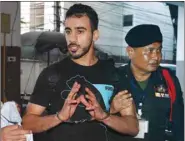  ??  ?? Hakeem Alaraibi, a former member of Bahrain’s national soccer team who holds a refugee status in Australia arrives at court after he was arrested last month on arrival at a Bangkok airport based on an Interpol notice issued at Bahrain’s request, in Bangkok, Thailand.