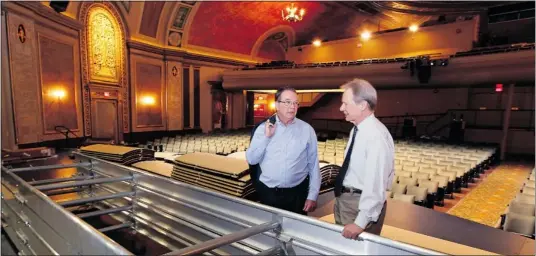  ?? NICK BRANCACCIO/THE Windsor Star ?? Windsor Symphony Orchestra general manager Paul Meanwell, left, and Capitol Theatre managing director Jeth Mill observe pieces of the orchestra shell, which
is being installed to assist with acoustics in the historic Capitol Theatre as WSO prepared...