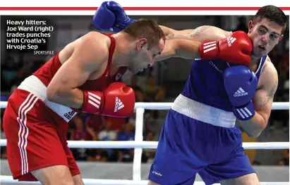  ?? SPORTSFILE ?? Heavy hitters: Joe Ward (right) trades punches with Croatia’s Hrvoje Sep