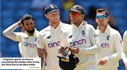  ?? Gareth Copley ?? England captain Joe Root is consoled by Ben Stokes after losing the Third Test to the West Indies