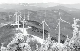  ?? ROBERT F. BUKATY/AP ?? Expansion of renewable energy in the U.S. is one of President Biden’s goals. Above, turbines are seen Feb. 6 atop Saddleback Wind Mountain in Carthage, Maine.