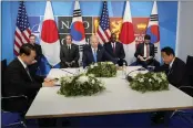  ?? SUSAN WALSH — THE ASSOCIATED PRESS ?? President Joe Biden meets with South Korea President Yoon Suk Yeol, left, and Japan's Prime Minister Fumio Kishida during the NATO summit in Madrid on Wednesday.