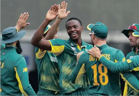  ?? Picture: AP PHOTO ?? FOURTH VICTIM: Kagiso Rabada, centre, celebrates taking the wicket of Adil Rashid during the third ODI at Lord’s yesterday.