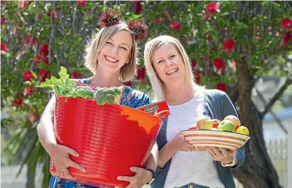  ?? ROSS GIBLIN/STUFF ?? Gabrielle Ralph, left, and Claire Turner run Nourish, a charity making Christmas hampers for families.