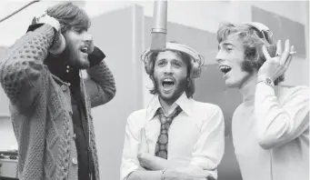  ?? MirrOrpix / pHOtO cOurteSy Of HbO ?? EARLIER DAYS: Barry, Maurice and Robin Gibb are seen recording in 1970 in HBO’s ‘The BeeGees: How Can You Mend a Broken Heart.’