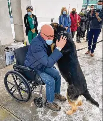  ?? RAMAPO-BERGEN ANIMAL REFUGE ?? Brian Myers is reunited with his dog Sadie in February following his discharge from a New Jersey rehab center. Myers, who lives alone, had a stroke in January, and Sadie was able to pull him across the room to his phone so he could call for help.
