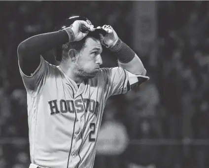  ?? Karen Warren / Staff photograph­er ?? Astros third baseman Alex Bregman realizes he came up a few feet short with his flyout to the Green Monster to end the game.