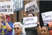  ?? ERIC GAY AP FILE ?? Demonstrat­ors join a rally to protest voting legislatio­n on the steps of the Texas Capitol in July.