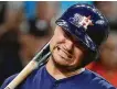  ?? Karen Warren / Staff photograph­er ?? Astros third baseman J.D. Davis cringes at a called third strike in the ninth inning.