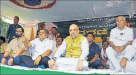  ?? PTI ?? BJP president Amit Shah (centre), party’s Karnataka CM candidate BS Yeddyurapp­a (right) and other party leaders sit on a daylong fast in Dharwad, Karnataka, on Thursday.