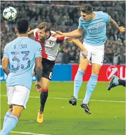  ??  ?? John Stones gets above his marker to head in one of his two goals against Feyenoord.