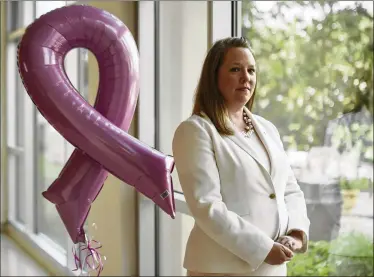  ?? ANDRES LEIVA / THE PALM BEACH POST ?? The new executive director of Susan G. Komen South Florida, Kate Watt, is pictured at Good Samaritan Medical Center on Oct. 12. The nonprofit’s goal is to reduce breast cancer deaths by 50 percent by 2026.