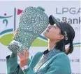  ?? AFP ?? Chun In-Gee celebrates after the trophy presentati­on.