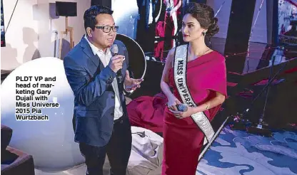  ??  ?? PLDT VP and head of marketing Gary Dujali with Miss Universe 2015 Pia Wurtzbach