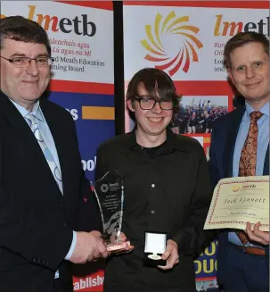 ??  ?? Jack Synnott, St. Oliver’s Community College receives a special award for the highest Leaving Certificat­e result in Ireland from Tomás Sharkey, Chairman of LMETB and John Halpin