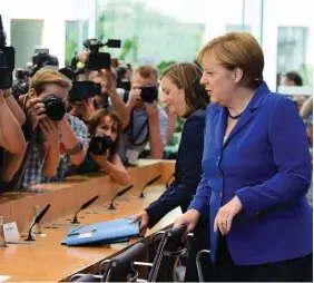  ?? AFP ?? Chanceler Angela Merkel enfrenta críticas da oposição para manter programas de assistênci­a