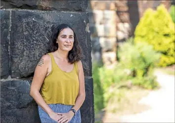  ?? Alexandra Wimley/Post-Gazette ?? Tina Dillman, an artist and curator who is organizing a series of nine outdoor salons, in Aspinwall Riverfront Park on Wednesday.