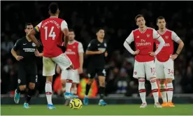  ?? Photograph: Tom Jenkins/The Guardian ?? Arsenal’s players look despondent after Neal Maupay’s winner for Brighton in the 80th minute.