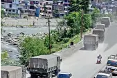  ?? PTI ?? Army vehicles move towards Leh on the Manali-Leh highway, in Kullu on Sunday. —