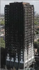  ?? The Associated Press ?? The scorched facade of the Grenfell Tower is seen in London on Thursday.