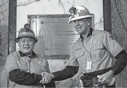  ?? RIO TINTO VIA AP ?? Mongolian Prime Minister Luvsannams­rain Oyun-Erdene, left, and Rio Tinto’s Chief Executive Jakob Stausholm mark the start of undergroun­d production at the Oyu Tolgoi mine in Mongolia on Monday.