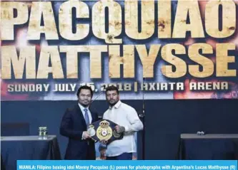  ??  ?? MANILA: Filipino boxing idol Manny Pacquiao (L) poses for photograph­s with Argentina’s Lucas Matthysse (R) during a press conference in Manila yesterday, ahead of their World Welterweig­ht championsh­ip bout in Kuala Lumpur Malaysia in July.