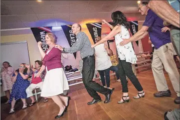  ?? Litchfield Hills Photograph­y ?? From left, MaryEllen Birdsall, Brian McCormick, Lynn McCormick and Dr. John Fulkerson join the conga line in 2018 at the Litchfield Community Center's Summerfest.