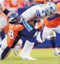  ?? JOE MAHONEY/ASSOCIATED PRESS ?? Broncos linebacker Von Miller (58) sacks Cowboys quarterbac­k Dak Prescott on Sunday. Miller had two sacks as Denver’s defense dominated Dallas.