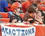  ?? MICHAEL ALLEN BLAIR — THE NEWS-HERALD ?? Browns’ fans Jack Gee, 9, left, of Stow and Carlo Rico, 9, of Chagrin Falls look on in dismay during the Browns’ 3420 loss to the Cardinals Nov. 1. These young fans have no