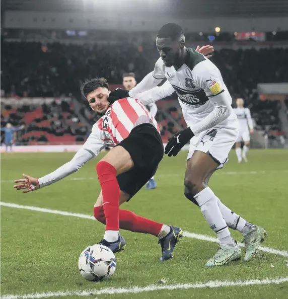  ?? ?? Sunderland’s Leon Dajaku is challenged by Plymouth’s Jordon Garrick.