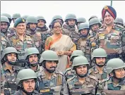  ?? ANI ?? ■ Defence minister Nirmala Sitharaman (centre) with troops of the 28th Infantry Division at a forward post in J&amp;K on Sunday.