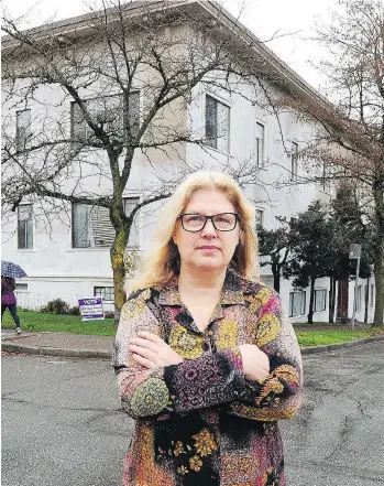  ?? NICK PROCAYLO ?? Valerie Farina, standing outside her Kitsilano apartment building on Wednesday, is being evicted by the new landlord, which has offered tenants three escalating buyout offers ahead of planned renovation­s.