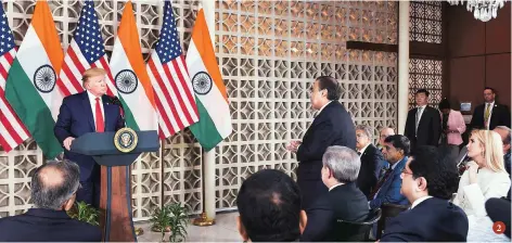  ??  ?? 2. Trump interacts with Reliance Industries Chairman Mukesh Ambani during a meeting with business leaders at US embassy