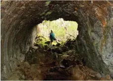  ??  ?? Park ranger Peter Hill at the entrance to a lava cave at Mt Eccles, which is the source of a lava flow that extends 50km to the coast.