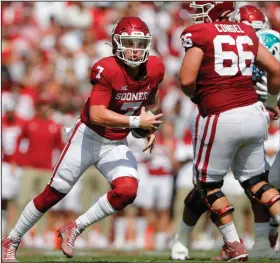  ??  ?? Oklahoma quarterbac­k Spencer Rattler had two touchdowns, one passing and one rushing, and finished with 304 passing yards to help the No. 2 Sooners defeat Tulane 40-35 on Saturday in Norman, Okla.
(AP/Alonzo Adams)