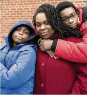  ?? ELIAS WILLIAMS The New York Times ?? Farah Despeignes, center, with her sons Rilan, left, and Amden Zahir in The Bronx on Jan. 27.