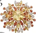  ??  ?? Glam up your outfits with bejewelled clips and brooches SUN BURST
