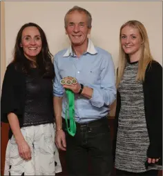  ??  ?? Leinster bronze over 35 masters team winners Carol Costello, Laura McCann (in absentia Helen Barry) are presented with their medals by Terry Kavanagh.