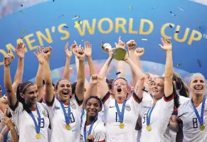  ?? ALESSANDRA TARANTINO/AP FILE ?? Members of the United States’ women’s soccer team celebrate after winning the World Cup in France in July.