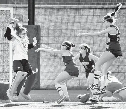  ?? AMY DAVIS/BALTIMORE SUN ?? From left, Garrison Forest goalie Alyssa Klebasko is greeted by teammates Ryleigh McComas (3), Elizabeth Bossi (8) and Celia Donner.