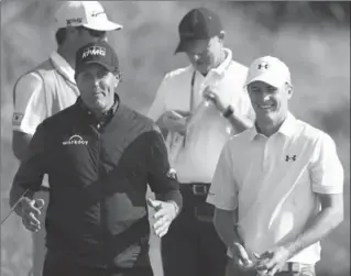  ?? DAVE THOMPSON, THE ASSOCIATED PRESS ?? Phil Mickelson gestures as he talks to Jordan Spieth during a practice round ahead of the British Open Golf Championsh­ip at Royal Birkdale on Tuesday.