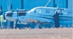  ?? Picture: FACEBOOK ?? PRE-FLIGHT: A surveillan­ce image of a pilot and plane in Australia before it departed for PNG,