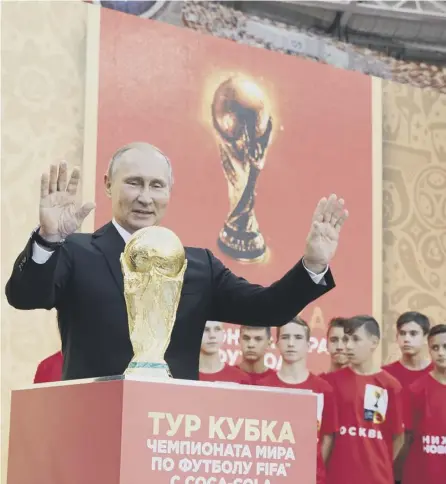  ?? PICTURE: FIFA/GETTY IMAGES ?? 0 Vladimir Putin is enjoying the sheen reflected on Russia from the World Cup