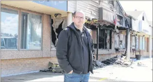  ?? SAM MCNEISH/THE TELEGRAM ?? Scott Hillier, owner of Coffee Matters on Commonweal­th Avenue in Mount Pearl, stands outside his shuttered shop, waiting for an inspector to come and look over his operation, which was affected by a fire in the neighbouri­ng Elite Tattoo Studios shortly...