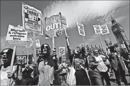  ?? [TIM IRELAND/THE ASSOCIATED PRESS] ?? Demonstrat­ors in Parliament Square protest a possible coalition government of the Conservati­ve and Democratic Unionist parties. The protest Saturday came as British Prime Minister Theresa May, a Conservati­ve, worked to fill out the ranks of her...