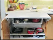  ?? PHOTOS: LARRY WONG/ POSTMEDIA NEWS ?? One of the MacGregors’ kitchen renovation­s added this expandable shelf, perfect for big baking projects.