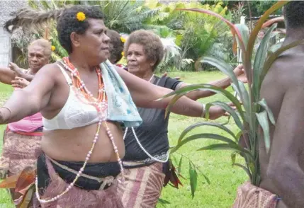  ??  ?? Woman dancing after receiving a bra in Vanuatu. Bras are considered as an expensive item for many women in the Pacific.