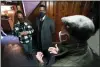  ?? PAUL SANCYA - THE AP ?? Tilicia Owens and Environmen­tal Protection Agency Administra­tor Michael Regan, center, listen to Detroit Water and Sewerage Department director Gary Brown in her basement Feb. 18 in Detroit.