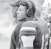  ?? LYNNE SLADKY/AP ?? Hurricanes quarterbac­k Malik Rosier watches the Florida State game on Oct. 6. Rosier replaced N’Kosi Perry in the second quarter Saturday night against Virginia.