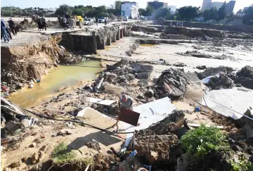  ??  ?? A picture in the Tunisian coastal town of Nabeul shows the collapsed Bir Challouf bridge following deadly flash flooding. — AFP photo